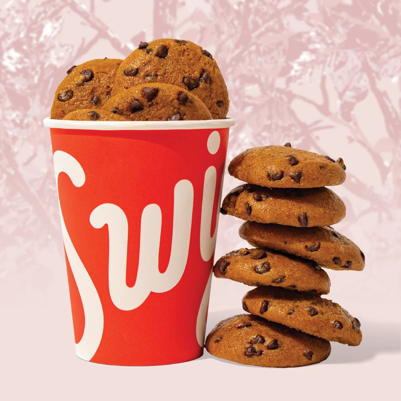 Mini pumpkin chocolate chip cookies in a red Swig cup
